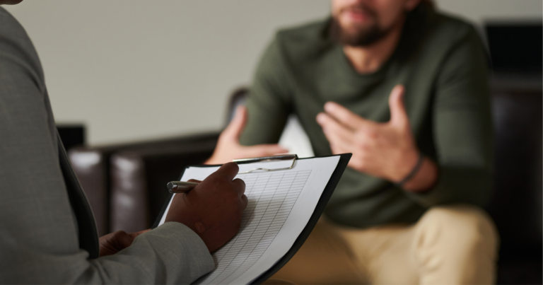 Therapist guiding a young adult during an intervention session, symbolizing hope and support