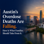 Crosswell Interventions featured image showing the Austin, Texas skyline at sunset for an article about declining Travis County overdose deaths and what families should know about fentanyl risk and intervention.